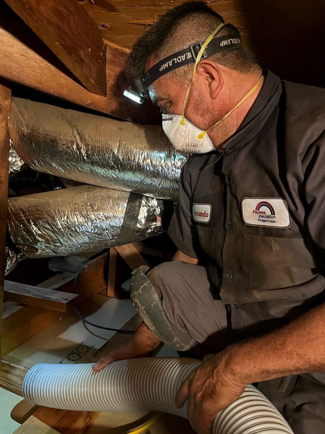 Payless employee removing residential insulation